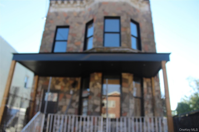 View of front of house with covered porch
