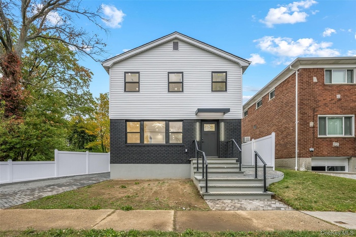 View of front of house featuring brick siding