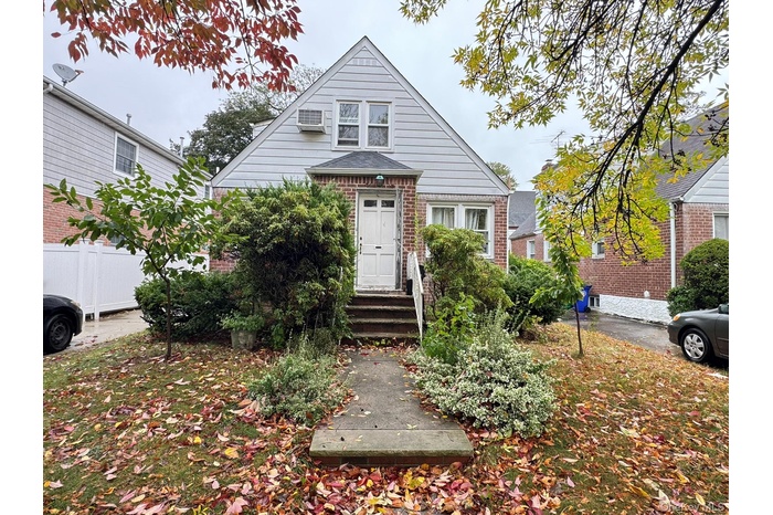 Bungalow with brick siding