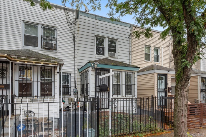 Traditional home with a fenced front yard