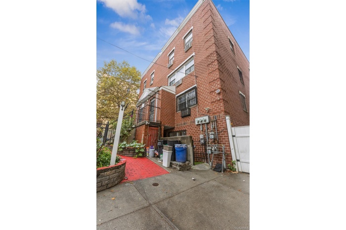 View of side of property featuring brick siding