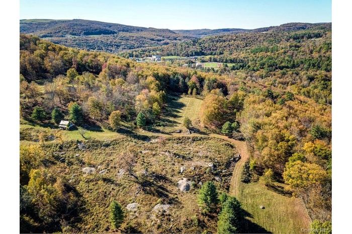 Aerial view of property and beautiful approach
