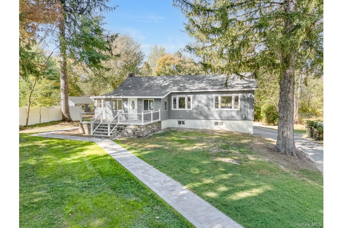 View of front of property, featuring a deck