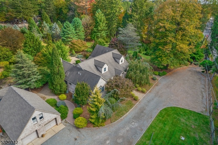 AERIAL VIEW OF HOME AND GARAGE