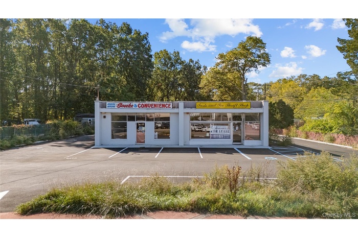 View of commercial location with uncovered parking
