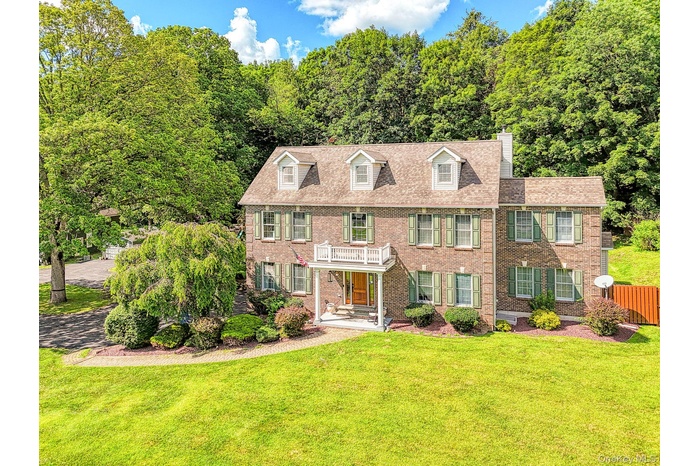 Colonial home with brick facade