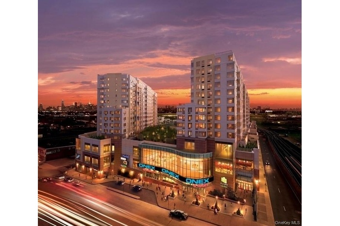 Property at dusk featuring a city view