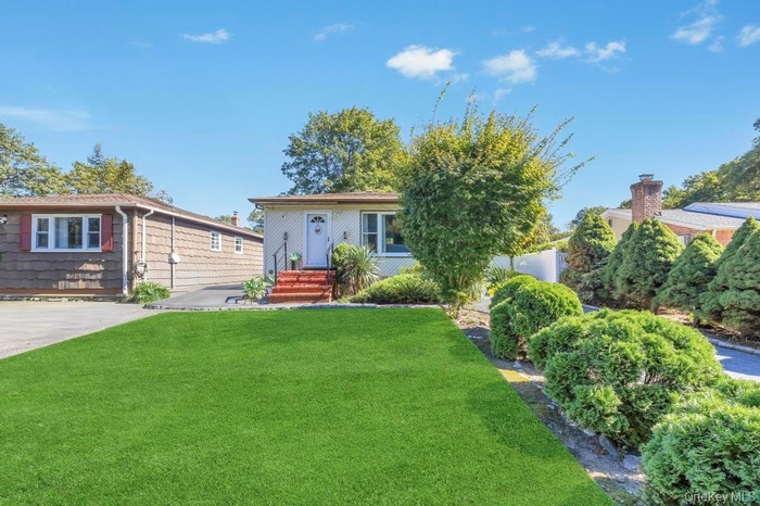 View of front of property with a front yard