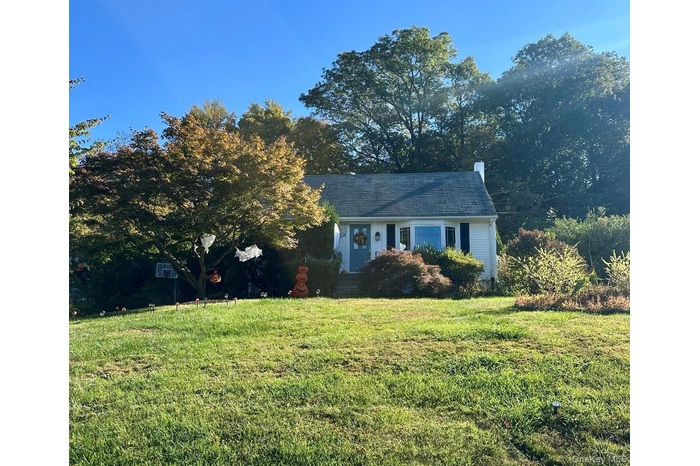 View of front of house with a front lawn