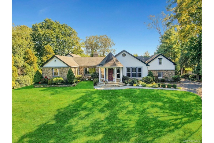 Sprawling Ranch-style home with a lush front lawn