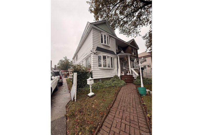 Traditional-style home with a porch