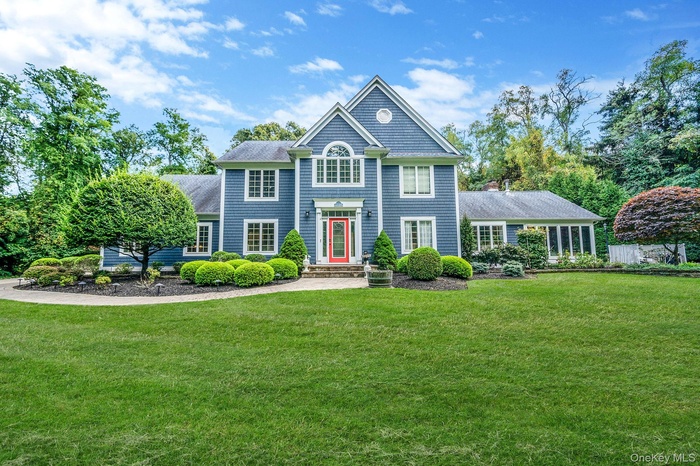 View of front of property with a front lawn