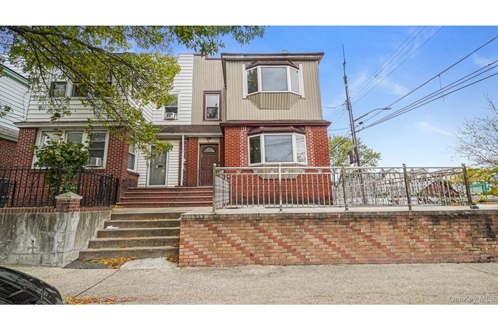 View of front of house with brick siding