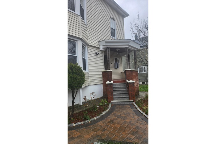 Entrance to property with a porch
