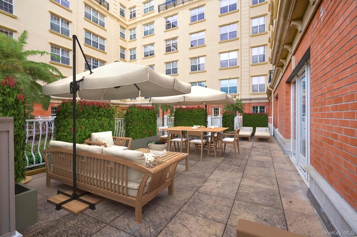 View of patio with an outdoor living space and outdoor dining area.  Virtually Staged