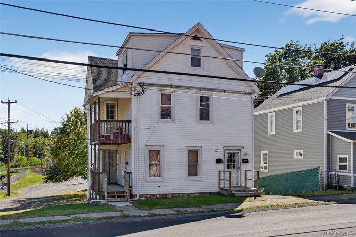 View of front of home with a balcony