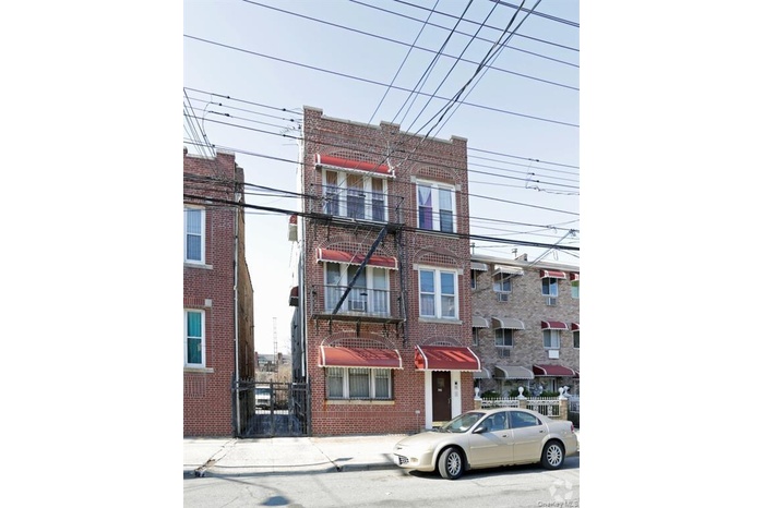 View of front of home featuring brick siding