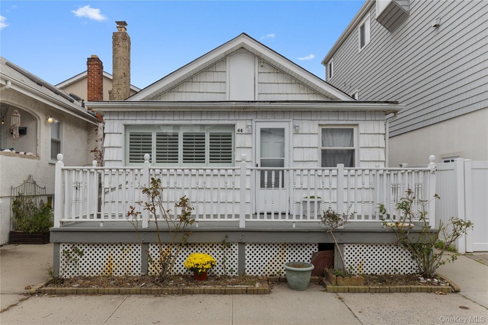 Back of house with a wooden deck