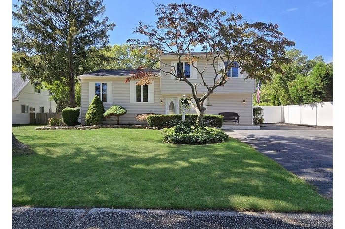 Tri-level home with asphalt driveway