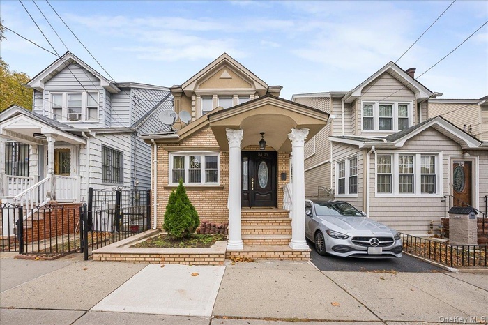 View of front of house with brick siding