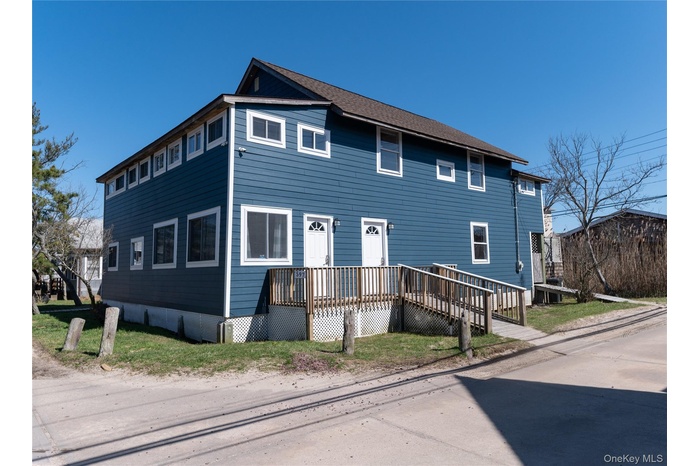Traditional-style house featuring a deck