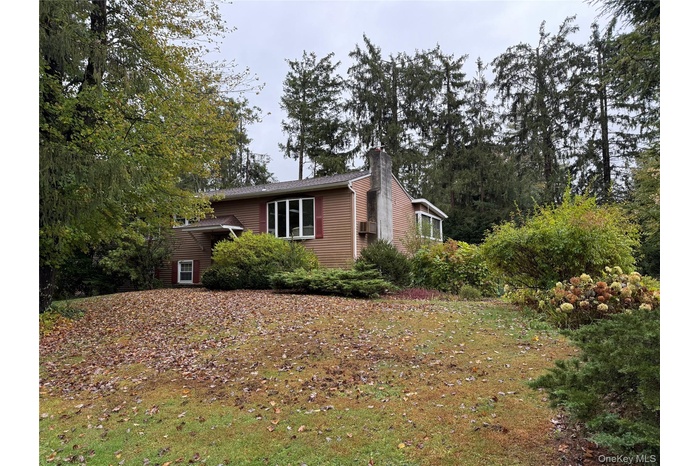 View of home's exterior with a chimney