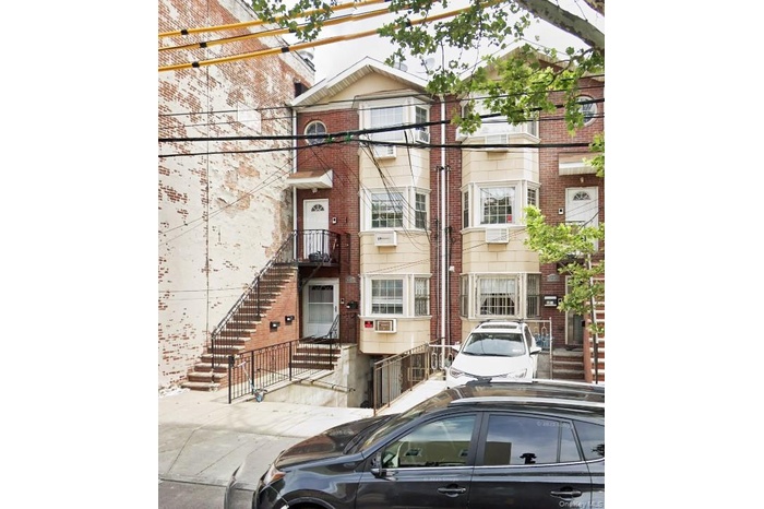 View of front of home featuring brick siding