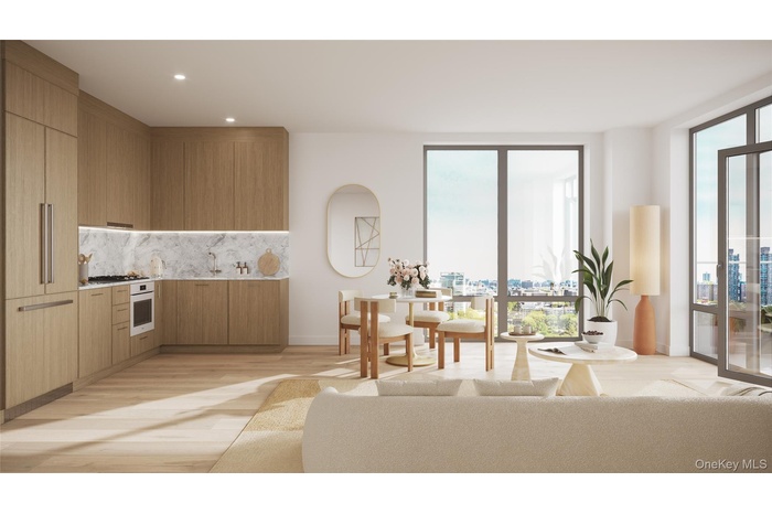 Kitchen with modern cabinets, light wood-style flooring, backsplash, oven, and recessed lighting