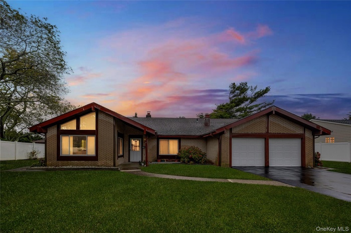 Digitally enhanced twilight  view of home.