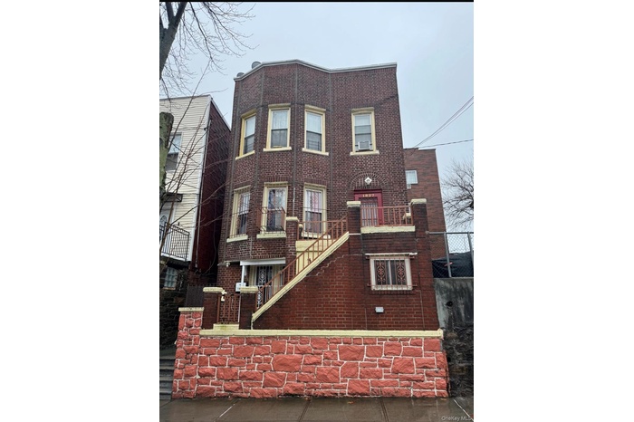 View of front of property featuring brick siding