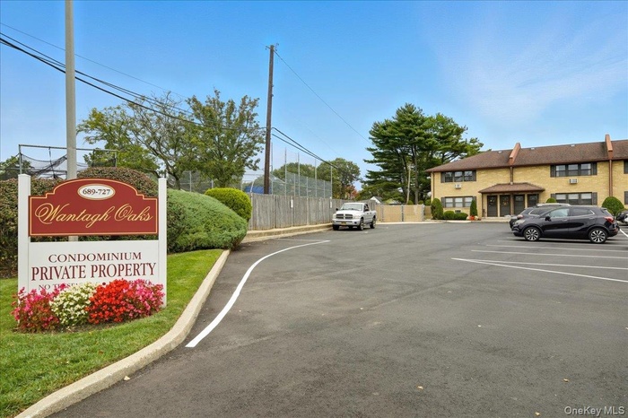 View of asphalt street featuring curbs
