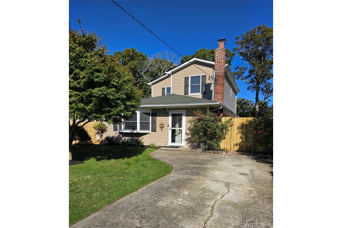 Traditional-style home featuring a chimney