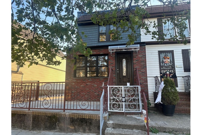 View of front of house with brick siding