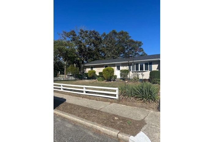 Ranch-style house with a fenced front yard