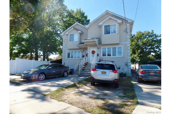 View of front of house with stucco siding