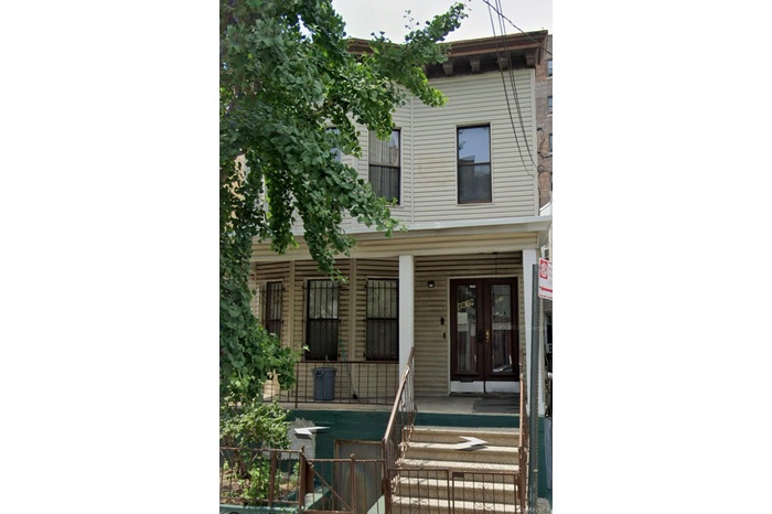 View of front facade featuring french doors and covered porch