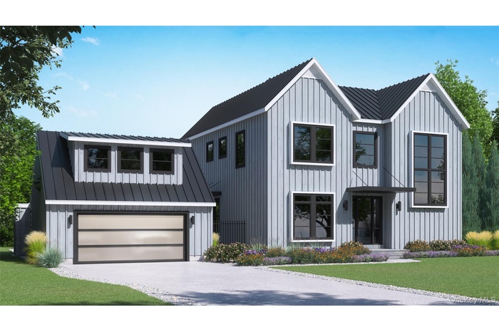 Modern farmhouse style home with board and batten siding, a front lawn, driveway, and a metal roof