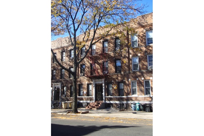 Townhome / multi-family property with brick siding