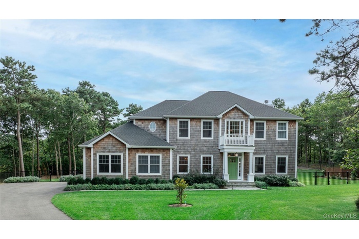 View of front of home with a shingled roof