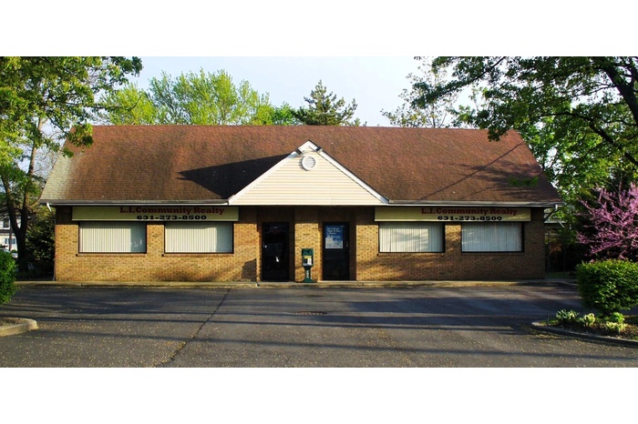 View of front of property with brick siding