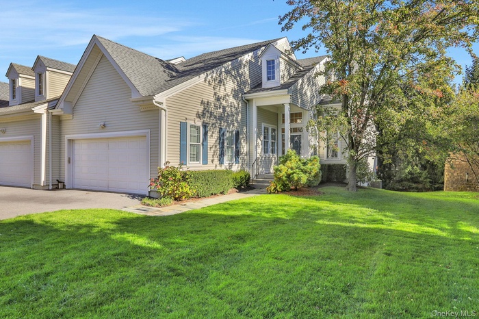 The entrance to the property welcomes you with a sense of space and charm. A large yard stretches out, offering plenty of room for outdoor activities,