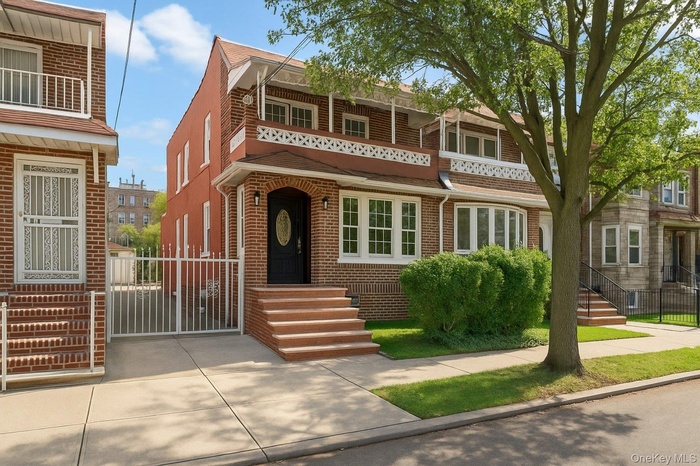 View of front of home featuring brick siding
