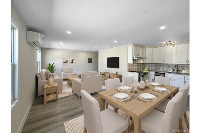 Dining area featuring light wood-type flooring, a wall mounted AC, and recessed lighting