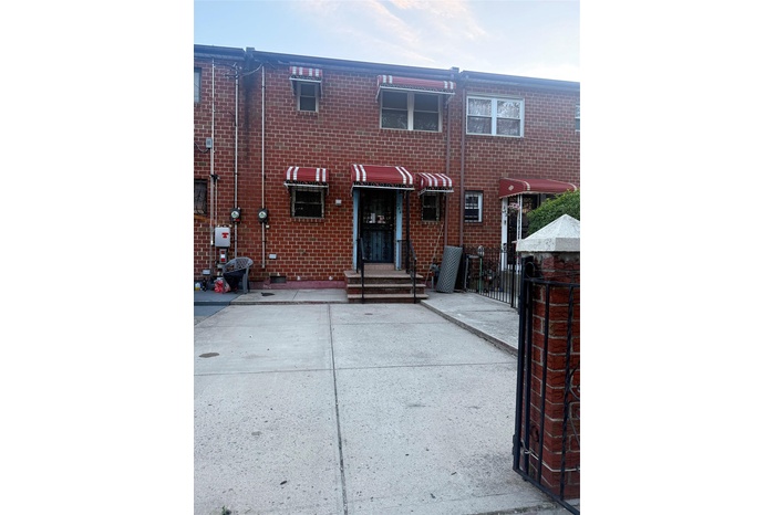 View of front of house featuring brick siding