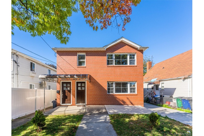 Traditional home with brick siding