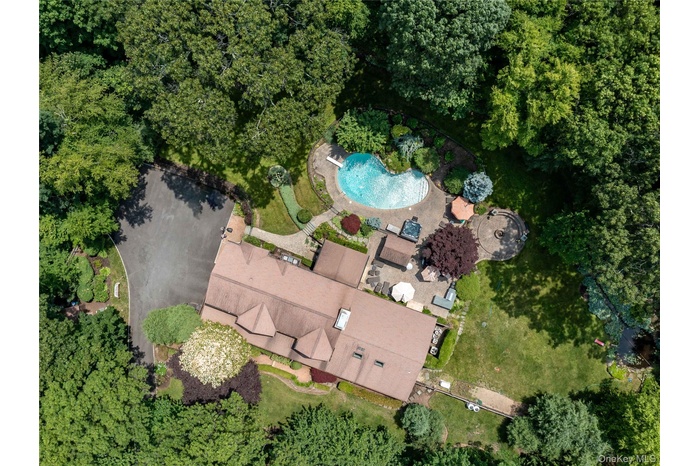 Aerial view of property's location with a pool
