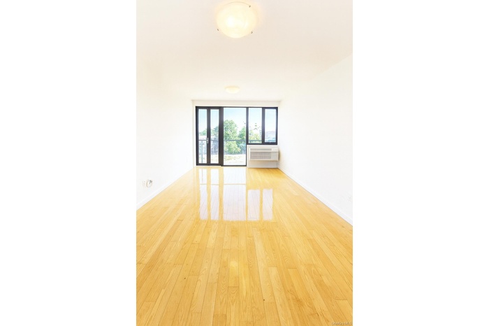 Spare room with wood finished floors and baseboards