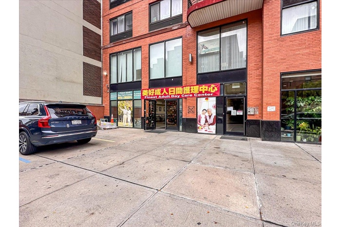 View of commercial location with uncovered parking