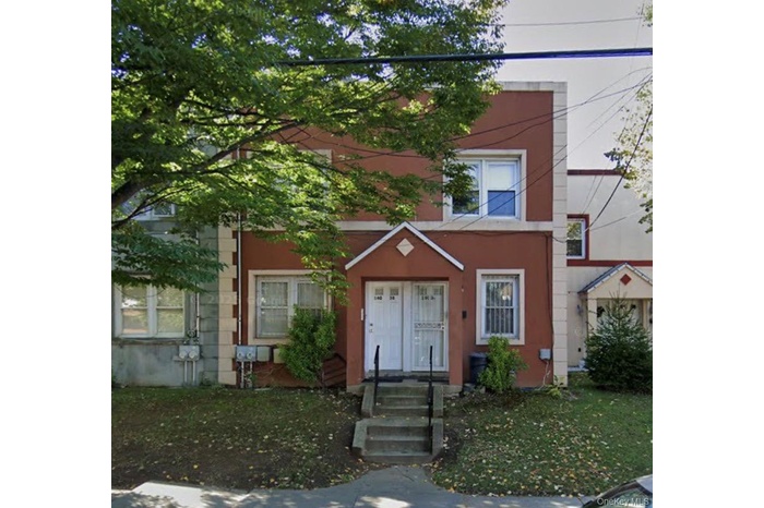 View of front of property featuring stucco siding