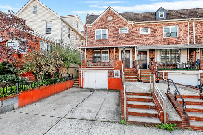 View of front of property with brick siding, concrete driveway, an attached garage, roof with shingles, and a porch